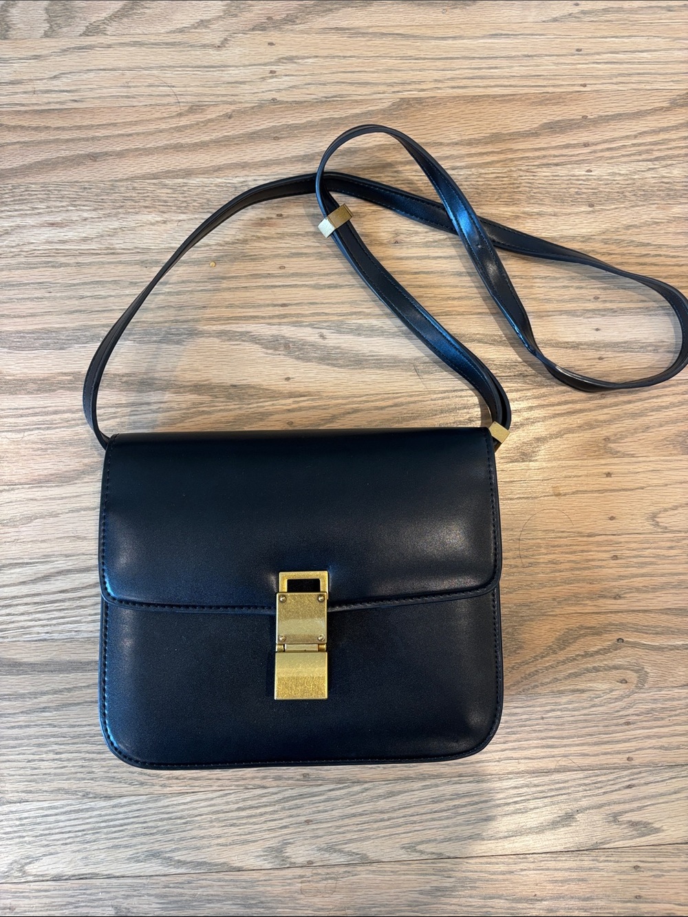 Classic Black Leather Crossbody Bag with Gold Lock